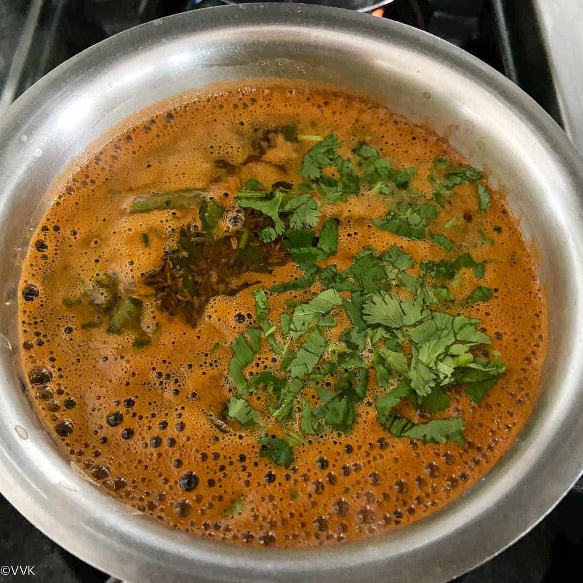 adding remaining cilantro and the tempering