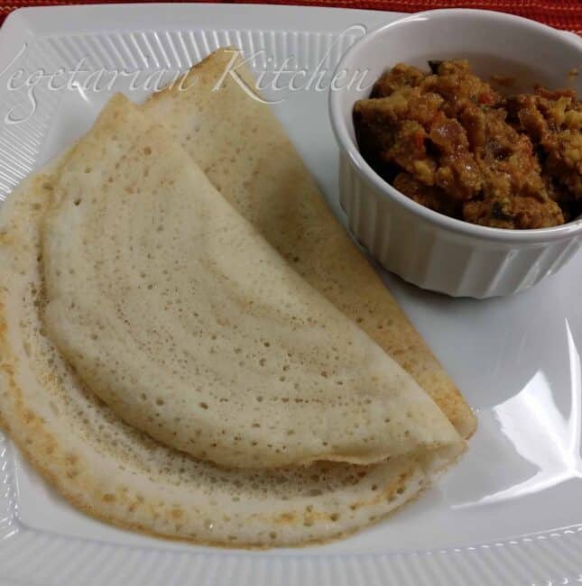 Serving Dosa And Vadacurry on a big white plate