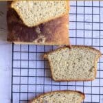 wheat bread slice placed on cooling rack with text overlay for pinterest