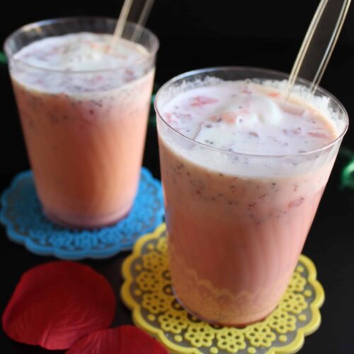 Serving Jil Jil Jigarthanda with China Grass and Evaporated Milk in two glasses