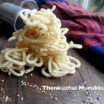 Closeup of the delicious looking Thenkuzhal Murukku on a wooden table