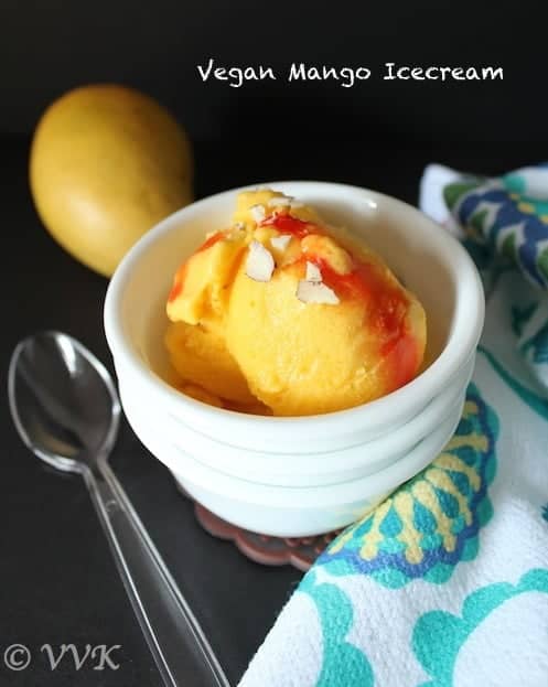 Xanthan Gum Mango Ice Cream looking extra inviting and delicious and served in a little white bowl
