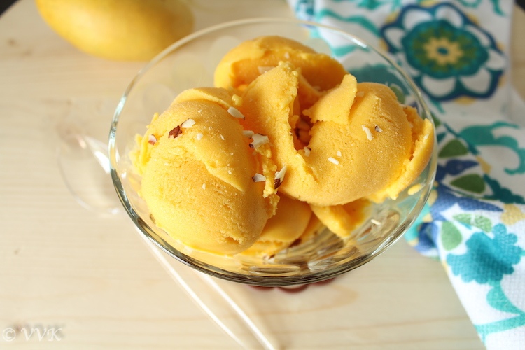 A big glass bowl full of the delicious Vegan Mango Ice Cream made Using Xanthan Gum