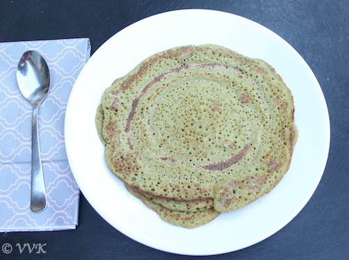 Delicious Vallarai Keerai Dosai, Indian Pennywort Dosa, on a blue table, ready to be enjoyed for breakfast