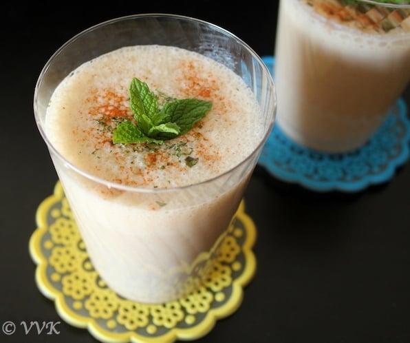 Spicy Savory Tamarind Lassi looking extra inviting with mint leaves on top