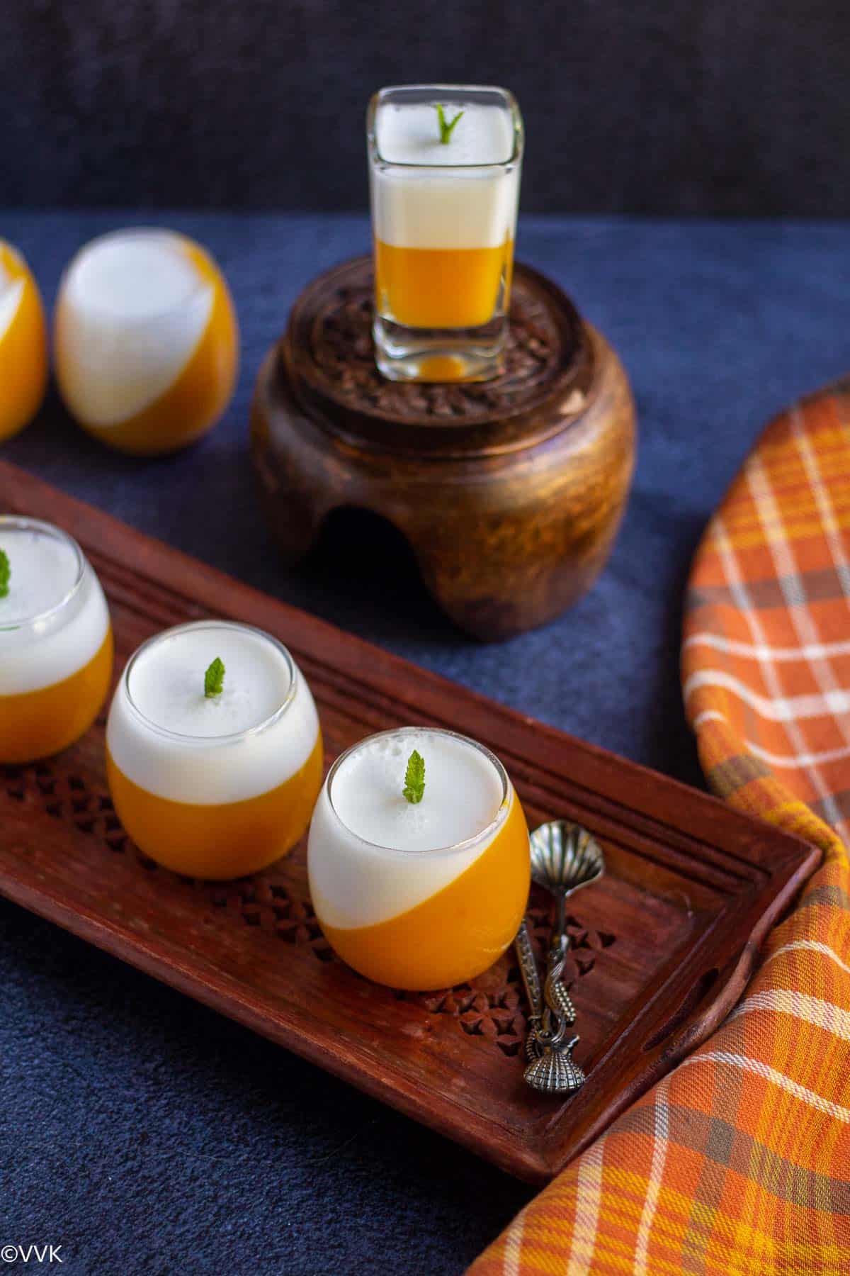 mango coconut jelly lined up in wooden tray