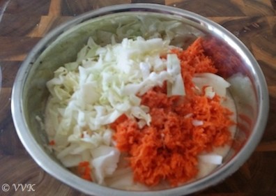 Mixing the veggies with the adai batter