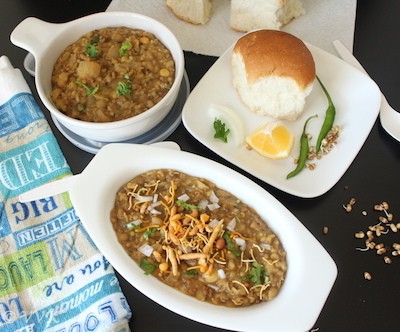 Misal Pav served hot and ready with a piece of a white bun on the side