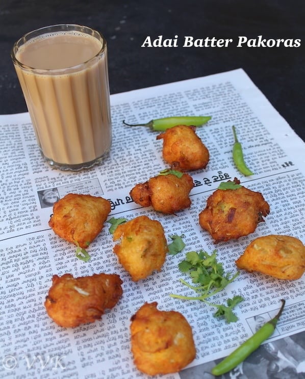 Adai Batter Vegetable Pakoras served with a glass of hot drink and decorated with green peppers