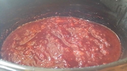 Mashing the sauce in the slow cooker