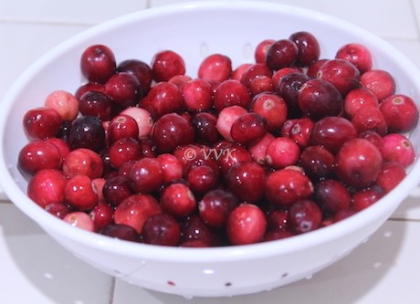 Fresh cranberries in a white bowl