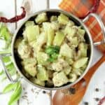 Overhead on the delicious Paleo style Bottle Gourd Gravy or Suraikai Kootu served in a cute metal pan