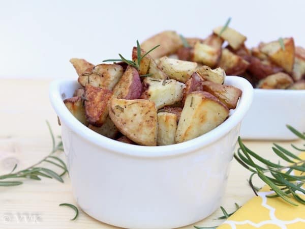 Oven Roasted Rosemary Potatoes served in a white bowl and a white casserole