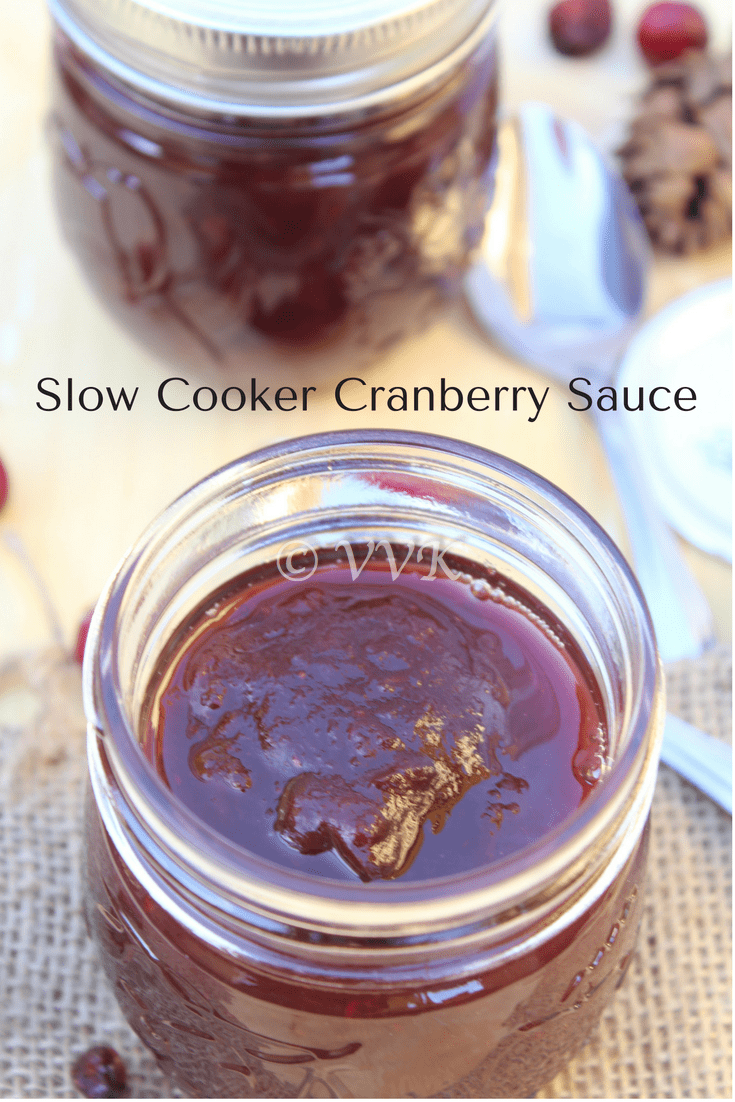 Delicious slow cooker cranberry sauce served in a jar with another jar blurred in the background