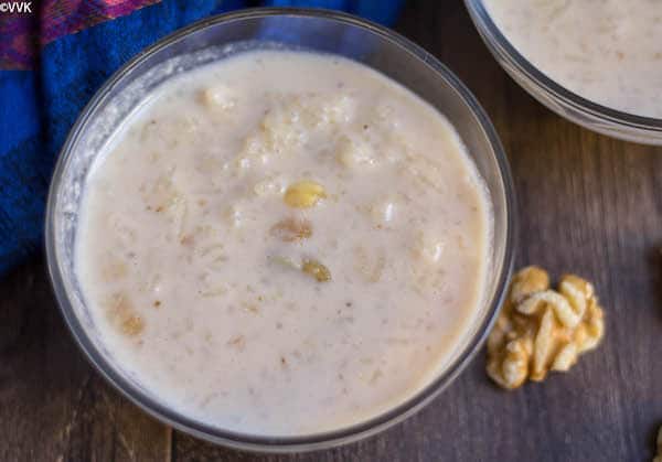 Instant Pot Rice and Walnut Kheer with a walnut right next to a glass bowl