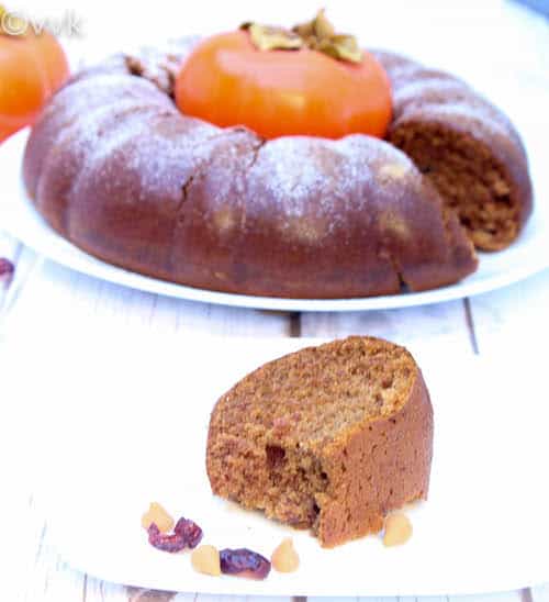 Eggless Persimmon Bundt Cake served on a white plate and on a white table