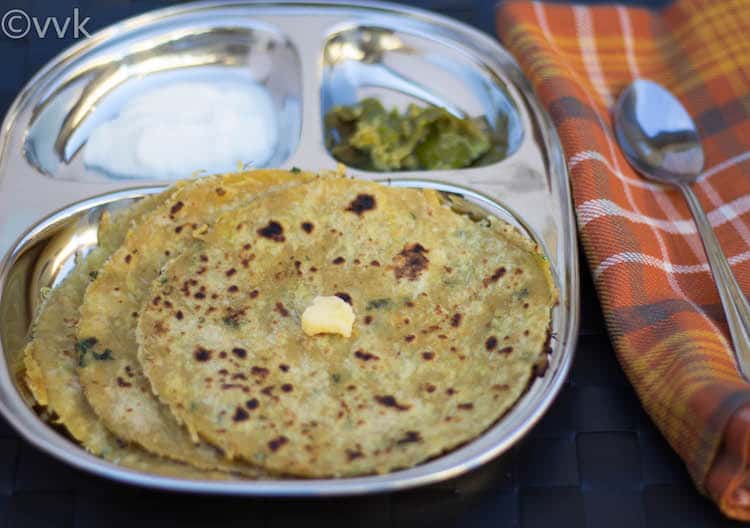 Mooli Paratha or Radish Paratha served with a metal spoon on the right side
