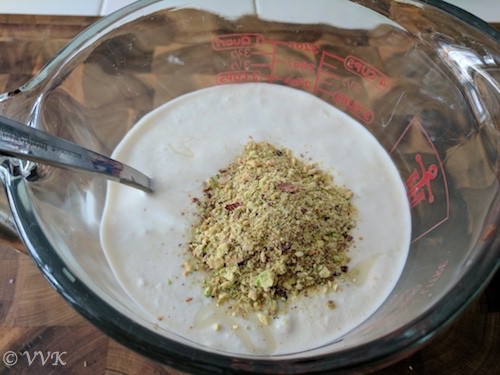 Adding the ground almonds, saffron milk mix and cardamom powder