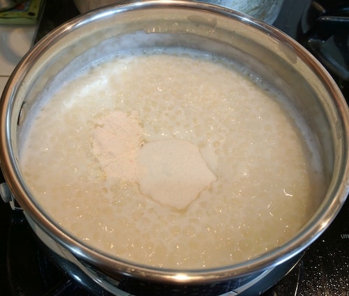 Adding sugar, cardamom powder and the custard mix