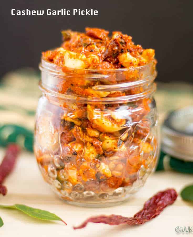 Cashew Garlic Pickle in a transparent jar on the table