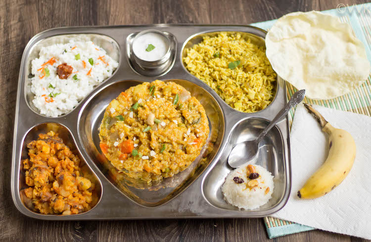 Saravana Bhavan Style Executive Thali served on a tray with a banana on the side