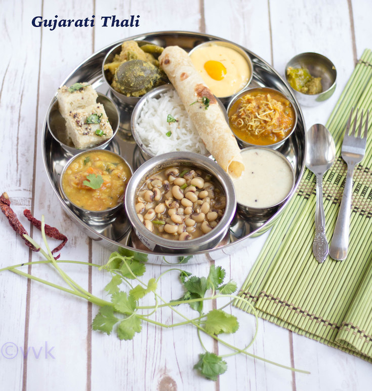 Gujarati Thali tray on a table with text overlay