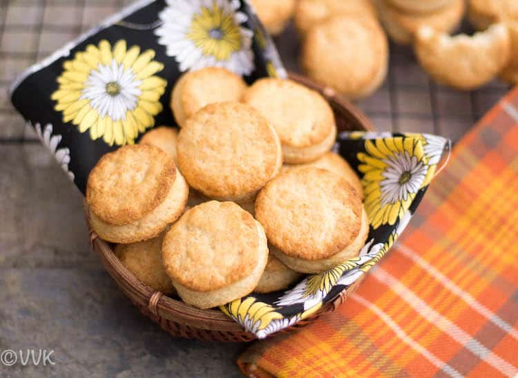 Baked Buttermilk Biscuits served in a bowl on top of a towel with cute flowers