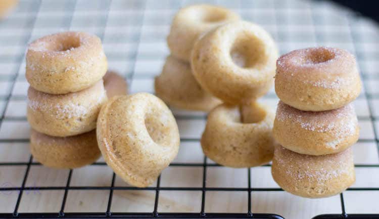 Stacks of Eggless Baked Mini Donuts made out of the easy Doughnuts Recipe