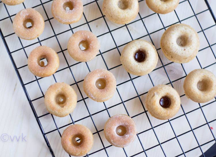 Many cute eggless baked mini donuts made using the doughnuts recipe