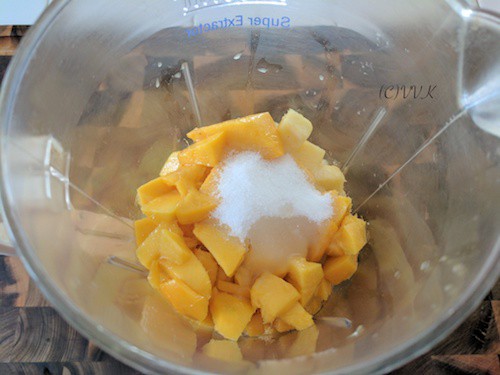 Recipe Step Image with All the Ingredients in a Blender Ready to Be Blended