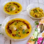Three bowls with delicious Instant Pot Dal Bafla looking colorful and so inviting
