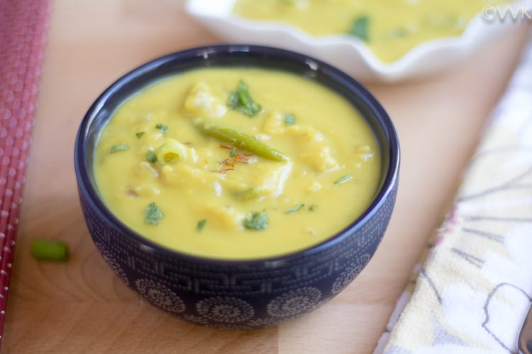 Instant Pot Sultani Dal served in a dark bowl with more dal in the background