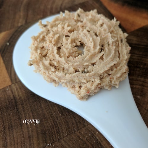 pressing the quinoa and roast gram flour murukku
