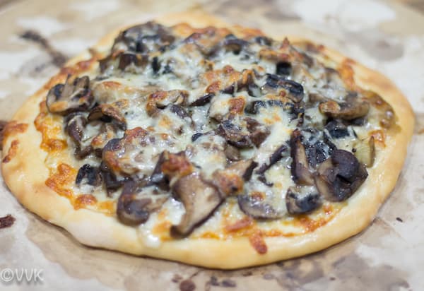 Letting the Wild Mushroom Pizza cool before serving