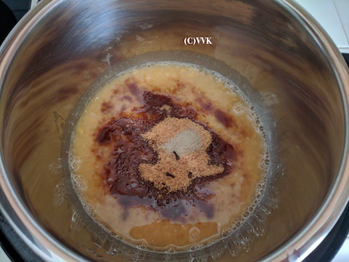 Adding jaggery, cloves and cardamom powder