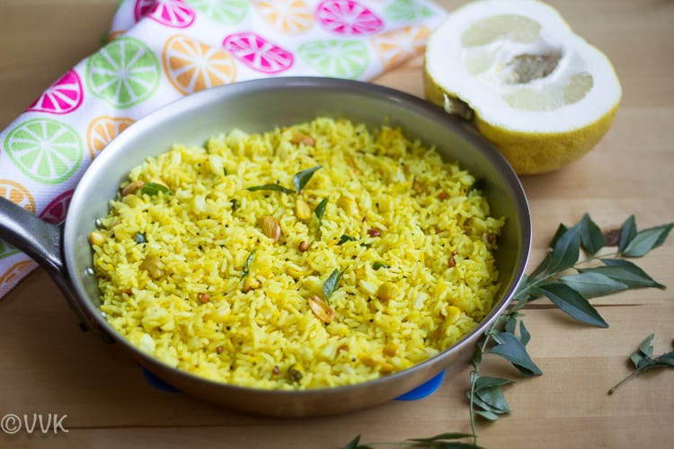 A large pan full of Wild Lemon Rice - Kadarangai Saadam, with a colorful towel in the background