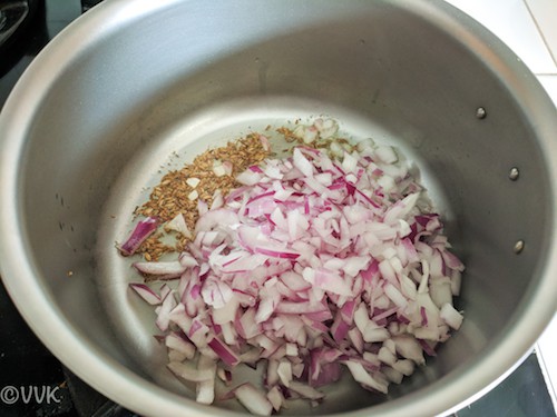 Adding the chopped onion and cooking until the onion is translucent
