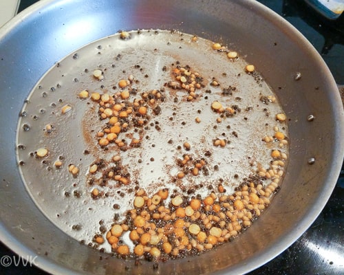 Adding the mustard seeds, urad dal, hing, and channa dal