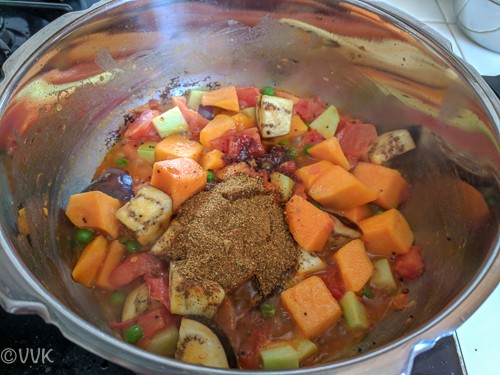 Adding the fresh masala, tamarind paste and jaggery