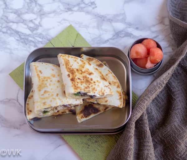 Queso Mushroom Quesadilla cut in halves and served in a lunch box