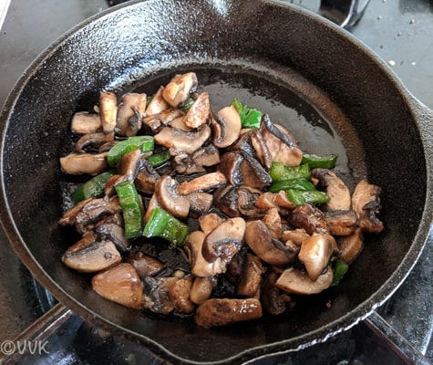 Adding chopped jalapenos and mushrooms.