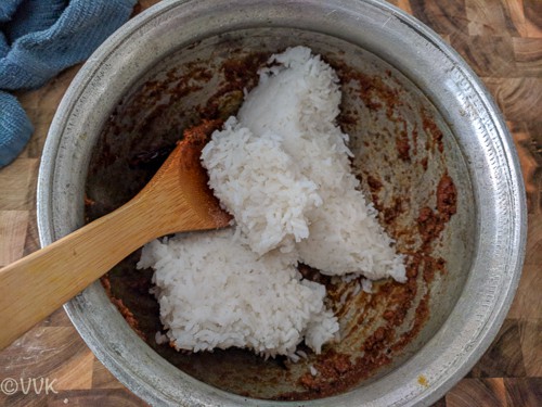 Adding rice, oil, and salt in a big bowl