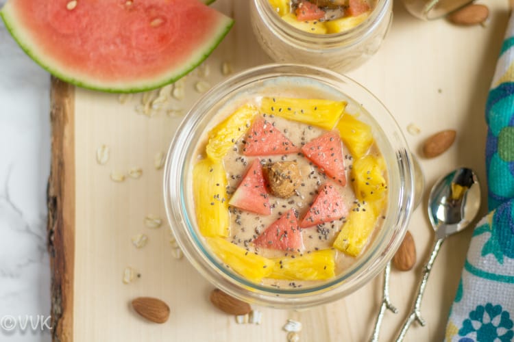 Overhead on Overnight Oats with Almond Butter and Banana with a bit of watermelon next to it