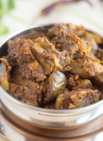square image of kathirikai podi curry served in kadai bowl