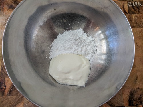 Combining the yogurt and sugar in a bowl