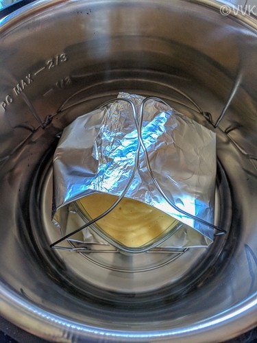 Placing the cake pan with the sling into the Instant Pot