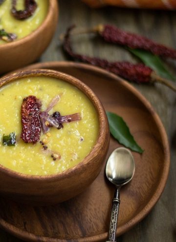Instant Pot Kerala Parippu Curry - Closeup on One of the Bowls with Chili Pepper on the Side