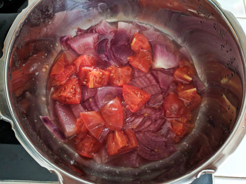 Pressure cooking the chopped onion and tomatoes