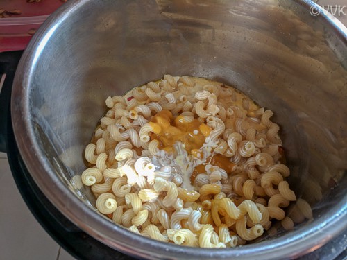Adding cooked pasta, cream, pasta water and the sweet potato sauce