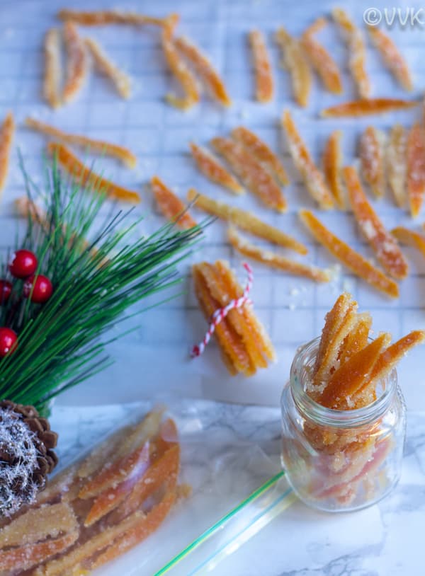 Candied Orange Peels with Christmas tree in the foreground